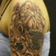 龍と家紋の宝玉のタトゥー