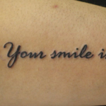 筆記体「Your smile is」
